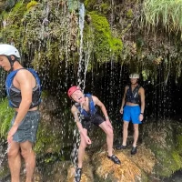 Party drinking from a water dripping from the rocks near Cetina river