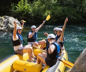 All smiles and fun on rafting tour in Omiš with Rio rafting team Peolple heaving fun while rafting trough Omiš