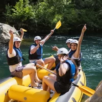 All smiles and fun on rafting tour in Omiš with Rio rafting team Peolple heaving fun while rafting trough Omiš
