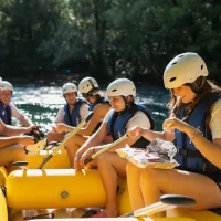 The Rafting crew, eating traditional dalmatian meal soparnik, on a Rio Rafting& Food tour