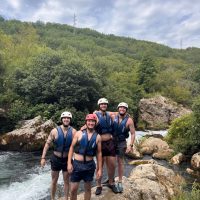 Happy guests posing for a picture after Rio Rafting tour