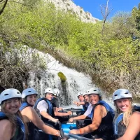 Great time with friends on rafting adventure in Croatia Rafting party coming near big waterfall near Split, Cetina