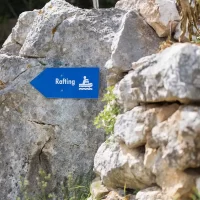 View of Omiš town from Cetina River rafting route sign for rafting in Croatia near Cetina